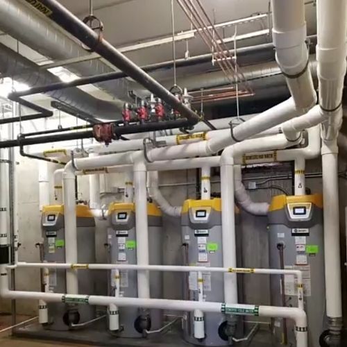 school locker room hot water process piping - The Geiler Company